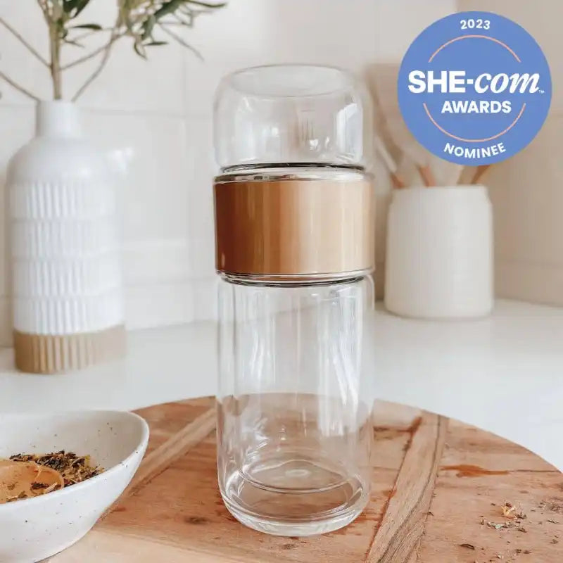 Double Wall Glass Tea Infuser Bottle by Us and The Earth - A She.com Awards Nominee. Enjoy your tea on-the-go with our premium Glass Tea Infuser Bottle.