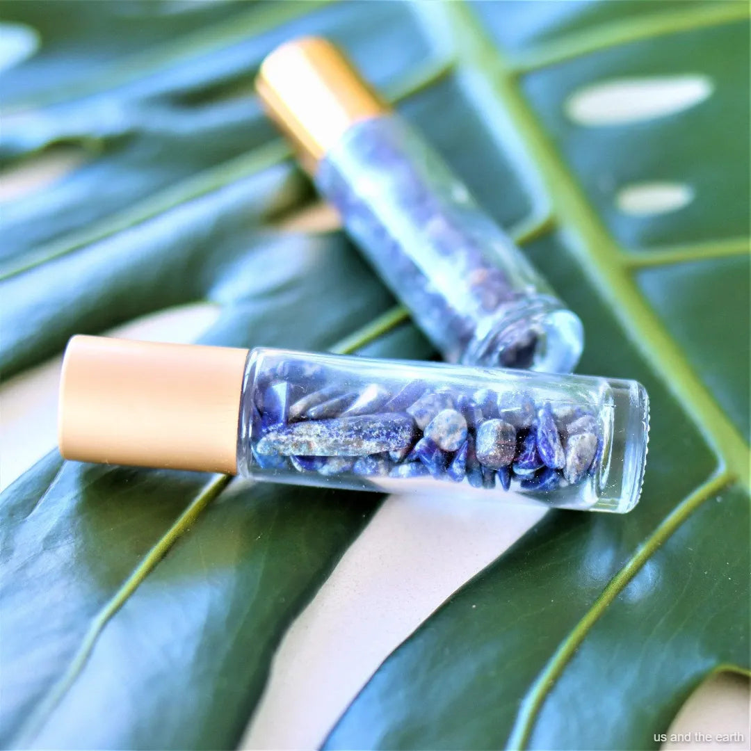 A top-down perspective view of the Amethyst Essential Oil Crystal Roller by - Us and The Earth