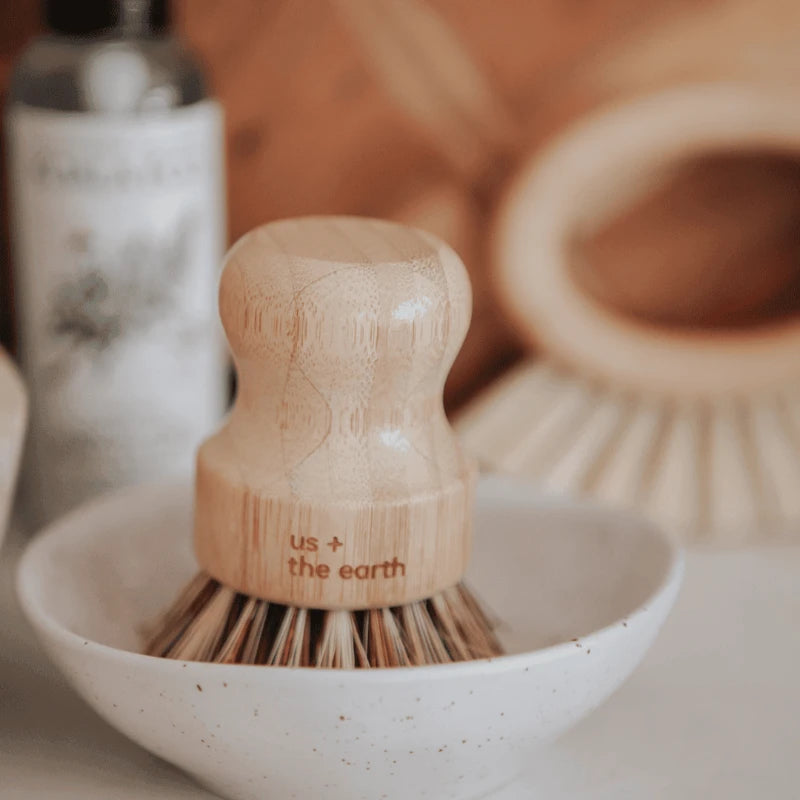 Pot brush made from eco-friendly materials, available at Us and The Earth